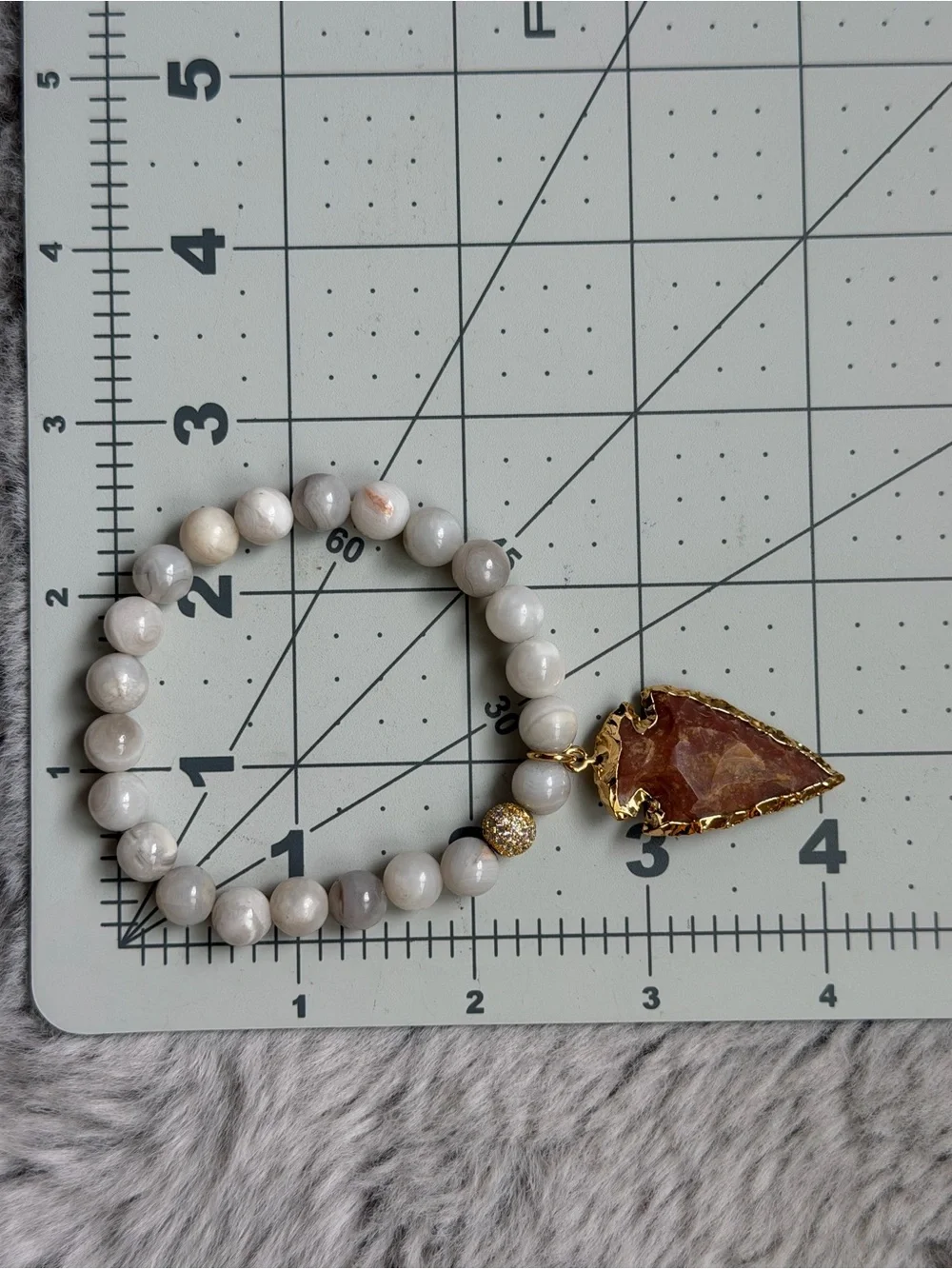 Semi-Precious White Beaded Bracelet with Gold-Edged Arrowhead Gemstone Charm